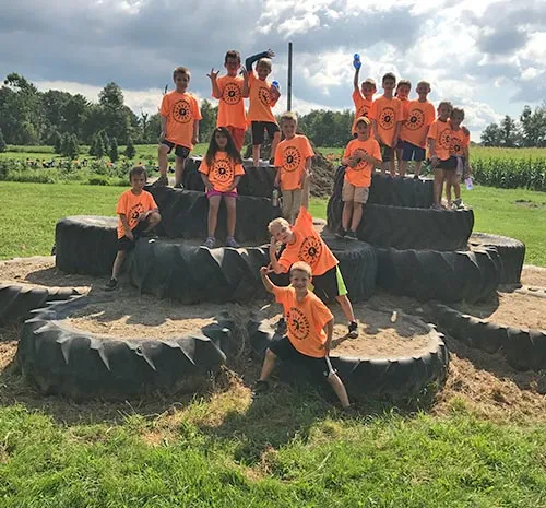 Tire Mountain at Ellms Farm with Children in Orange Shirts - Small