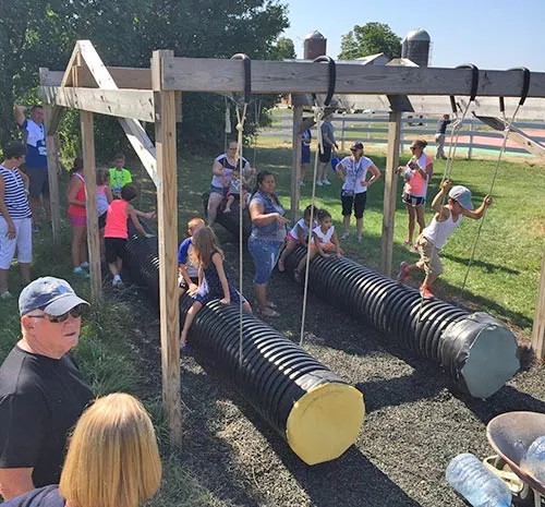 Ellms Farm tube gliders with families playing