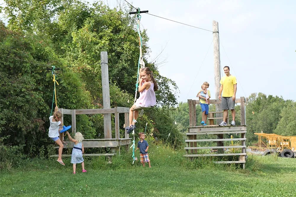 kids riding ziplines